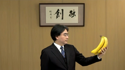 Satoru Iwata holding bananas