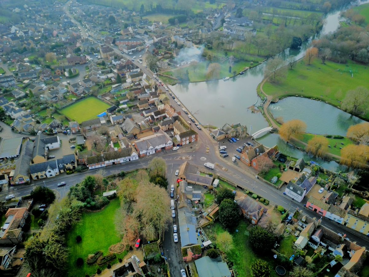 Drone shot of a suburban streets surrounded by small lakes