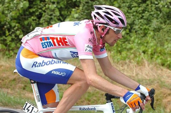 Denis Menchov (Rabobank) in the maglia rosa also sporting a pink helmet and glasses.