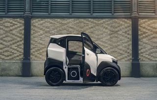 White and black Silence S04 electric city car with open door