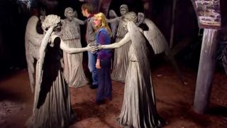 Sally being surrounded by Weeping Angels in Doctor Who's Blink