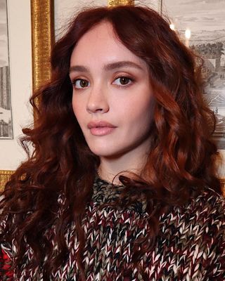 Actress Olivia Cooke with bouncy, copper curls