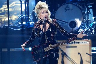 Dolly is going rock, and it's all thanks to Carl Dean