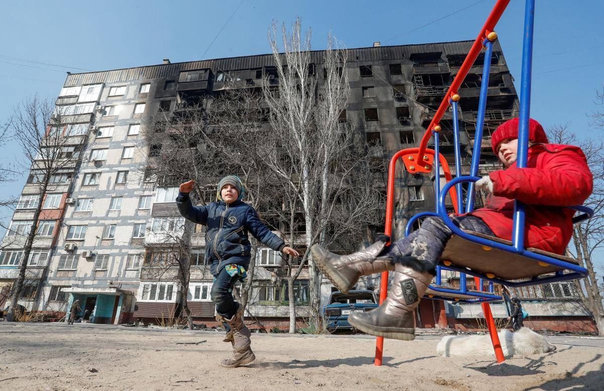 Two Ukrainian children on a playground