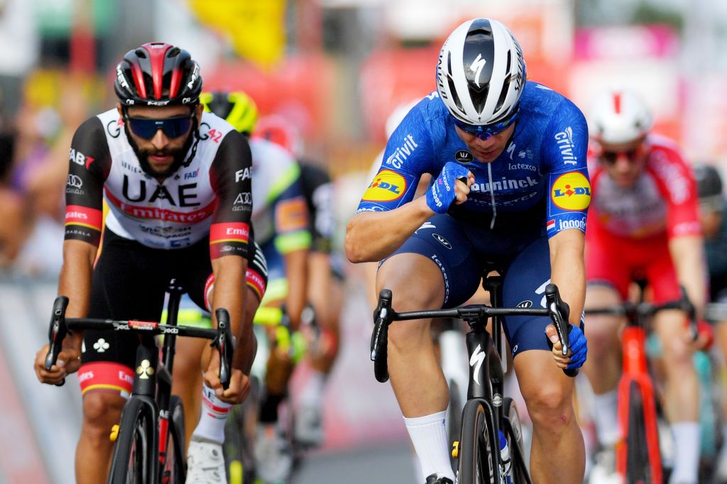 HEUSDENZOLDER BELGIUM JULY 21 Fabio Jakobsen of Netherlands and Team Deceuninck QuickStep stage winner celebrates at arrival Fernando Gaviria Rendon of Colombia and UAE Team Emirates during the 42nd Tour de Wallonie 2021 Stage 2 a 120km stage from Zolder Circuit to Zolder Circuit Race held at the Zolder Circuit due to flooding in the country tourdewallonie grandprixdewallonie on July 21 2021 in HeusdenZolder Belgium Photo by Luc ClaessenGetty Images