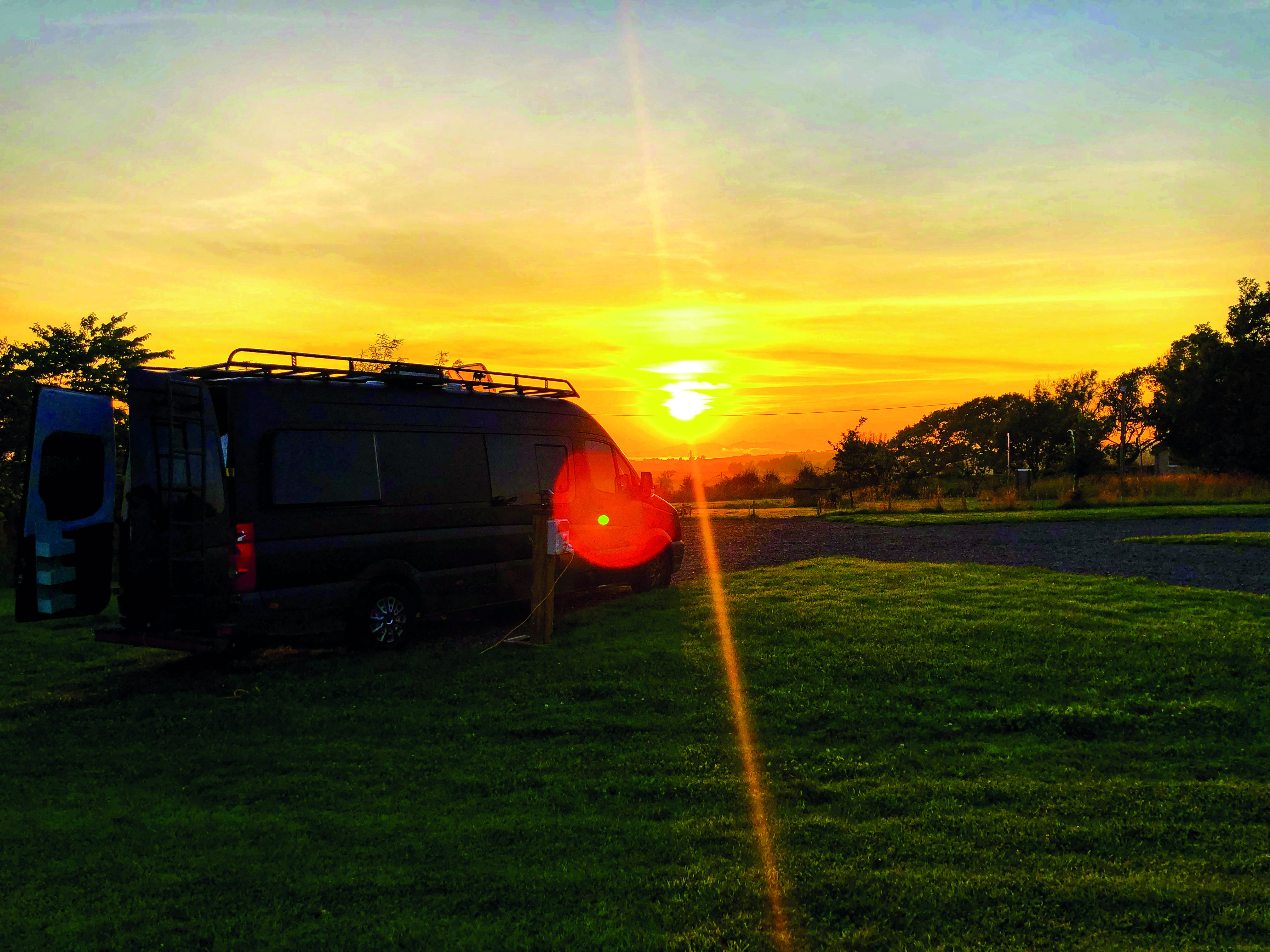 Sam Cooper with the campervan
