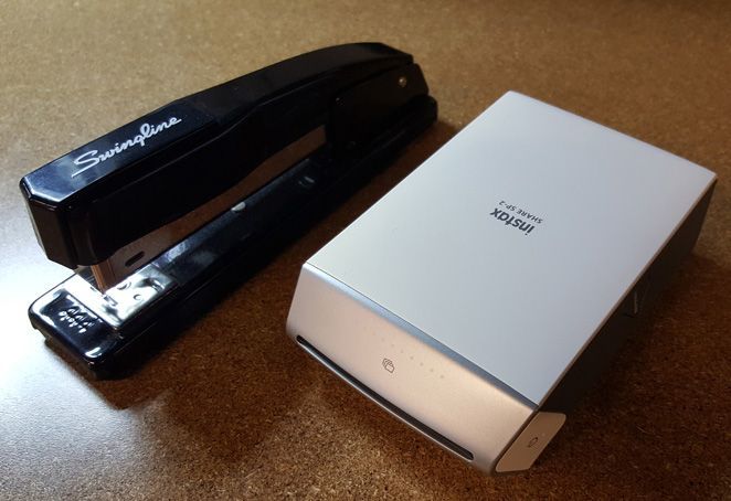 Fujifilm Instax SHARE SP-2 image: At 7.12 x 5 x 3 inches in size, the printer is just a bit too large to fit in a pants pocket, but it is still small enough to take on the go.