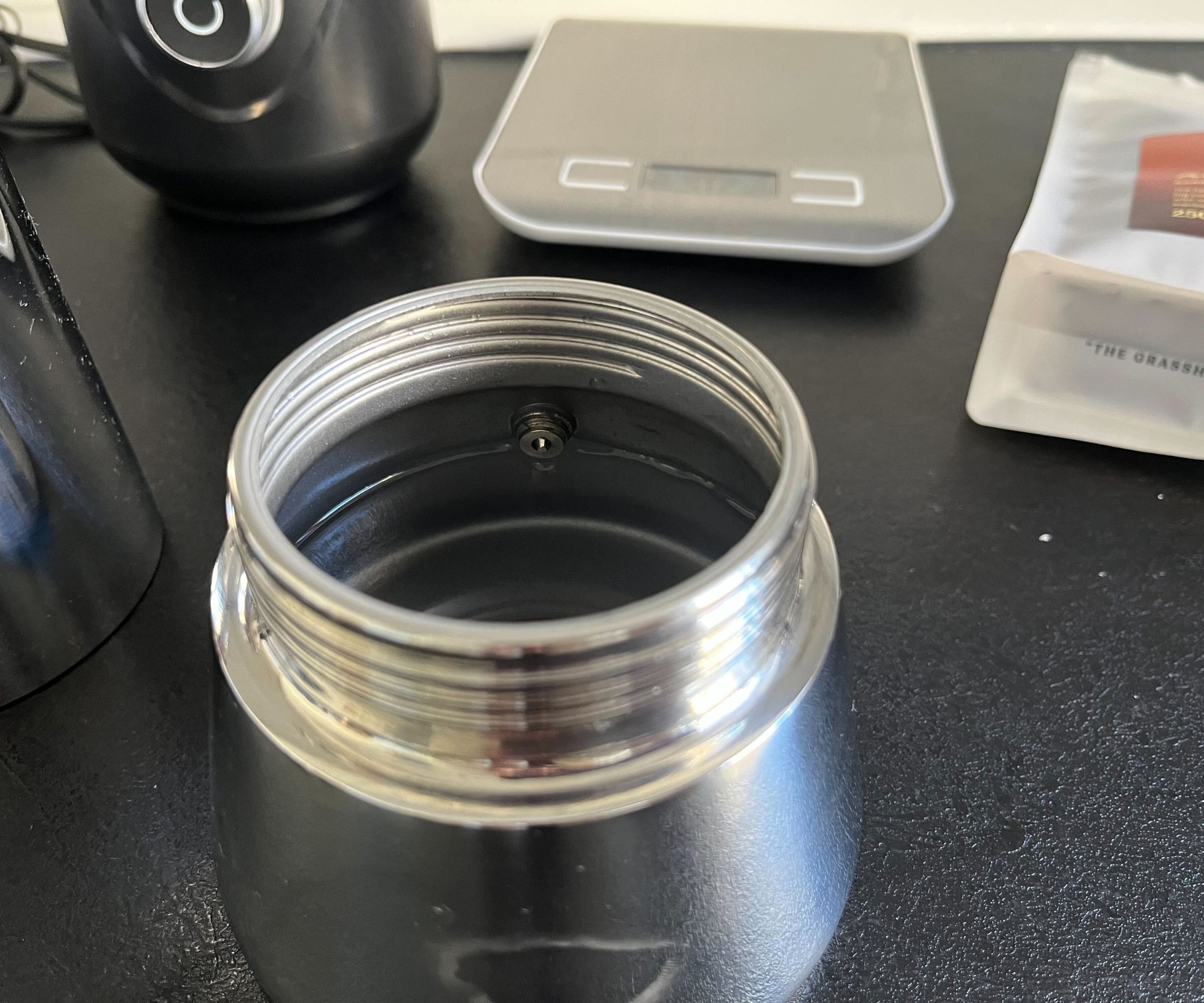 Water in the bottom section of the Bialetti Venus coffee maker, up to the pressure valve