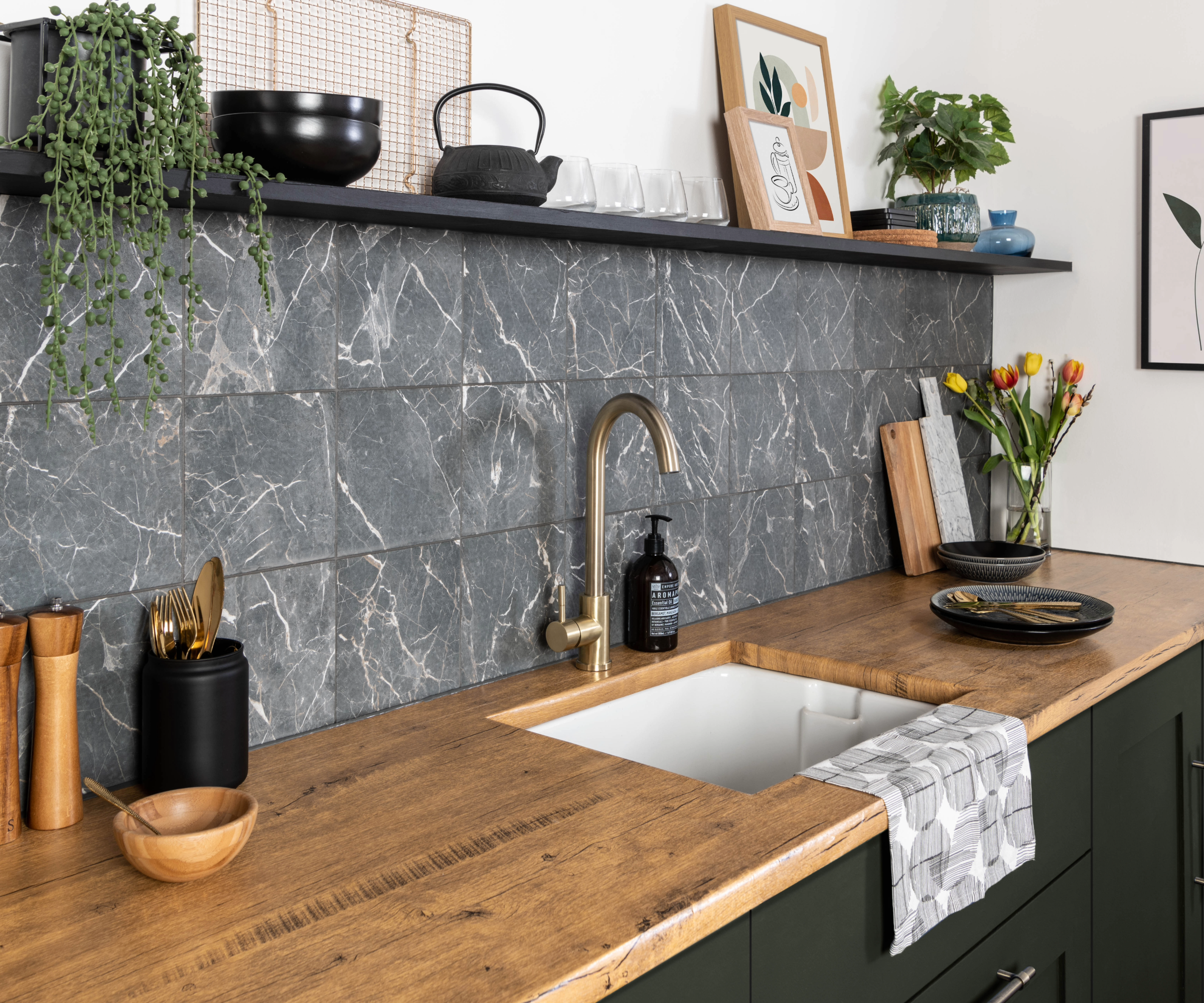 Kitchen with grey and white marble tiles and wooden worktop