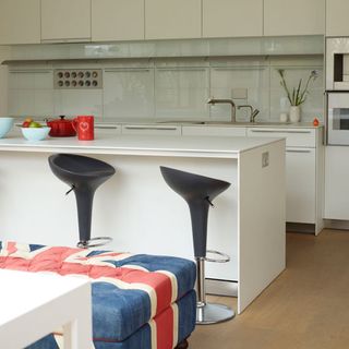 kitchen with white counter and black adjustable stool