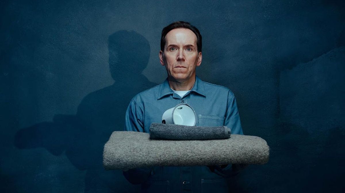 Jasper Tempest (Ben Miller) looking startled in a blue prison uniform in Professor T season 3