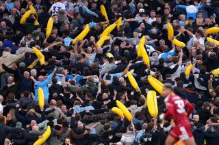 Manchester City fans celebrate their teams first goal scored by Erling Haaland
