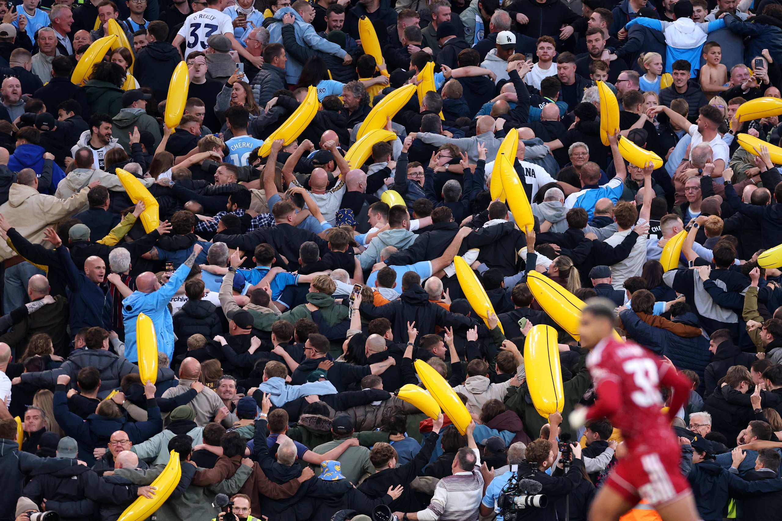 Manchester City fans celebrate their teams first goal scored by Erling Haaland
