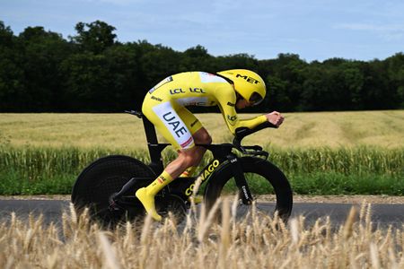 Tadej Pogačar, in the yellow jersey, rides a time trial during the 2024 Tour de France