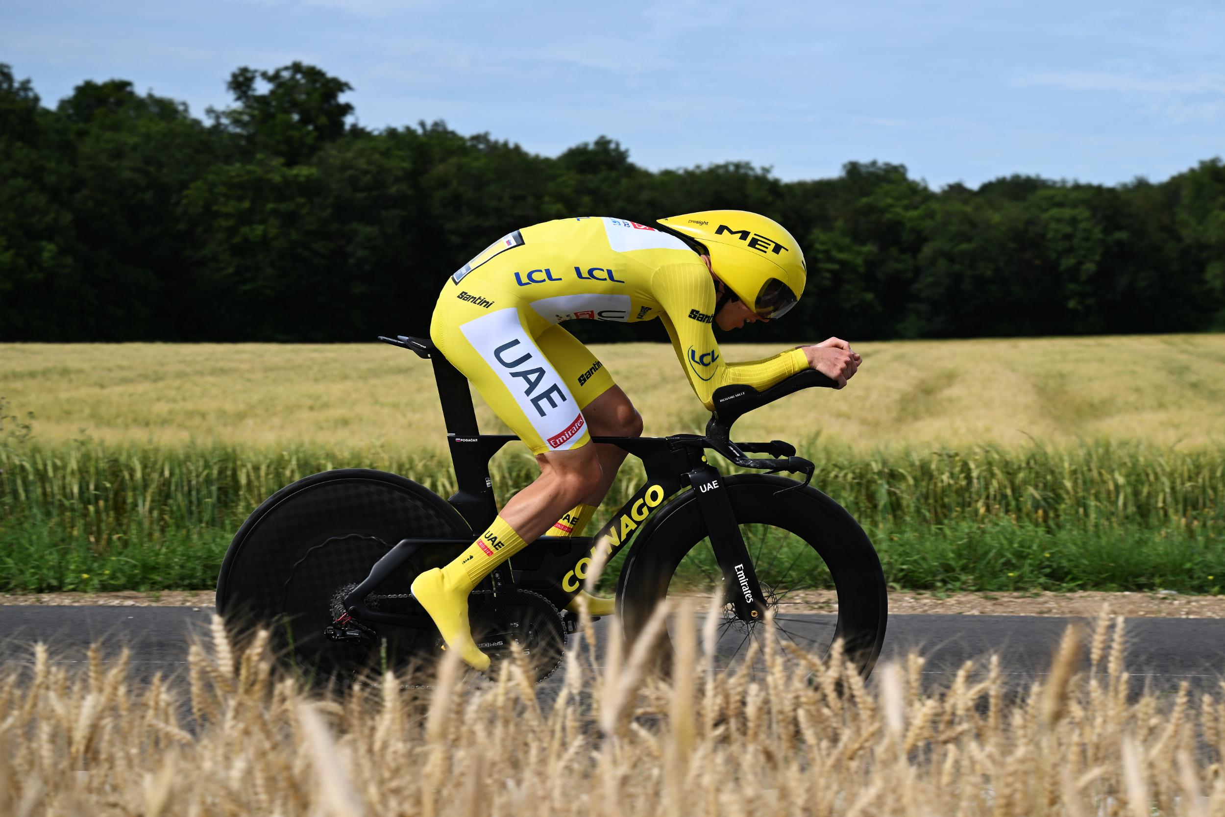 Tadej Pogačar, in the yellow jersey, rides a time trial during the 2024 Tour de France