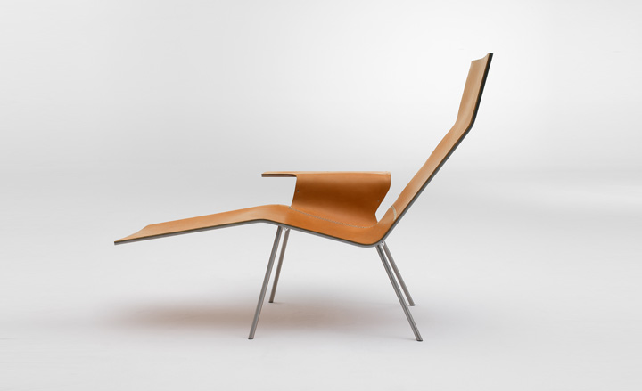 A side-on view of a slim leather lounge chair.