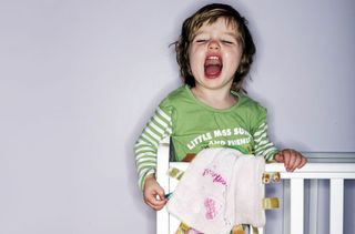 Little girl with blanket screaming