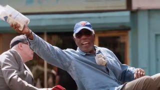 Morgan Freeman smiling and throwing flour