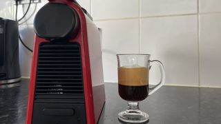 Latte next to Nespresso Essenza Mini