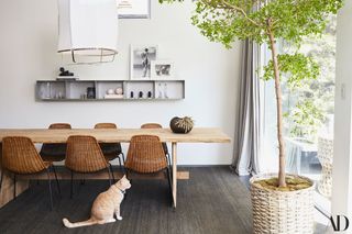 A dining room with a minimalistic shelf
