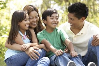 Happy asian family with two kids.