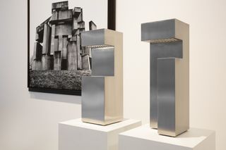 Bloc Floor Lamp 01 / Polished in front of photograph of brutalist architecture as part of Don Cameron exhibition in Sydney