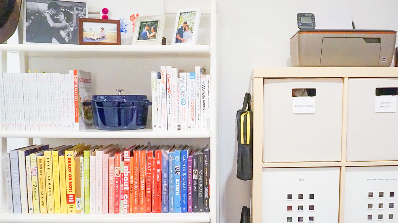 bookcases placed next to a filing cabinet in a white room