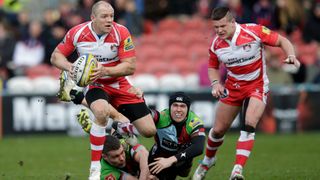 Mike Tindall of Gloucester is tackled during the Aviva Premiership match