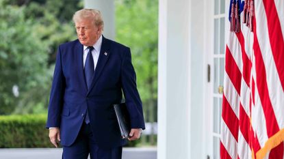 US President Donald Trump arrives for a luncheon in the Rose Garden of the White House in Washington, DC