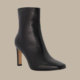 Flat lay image of black heeled boots 