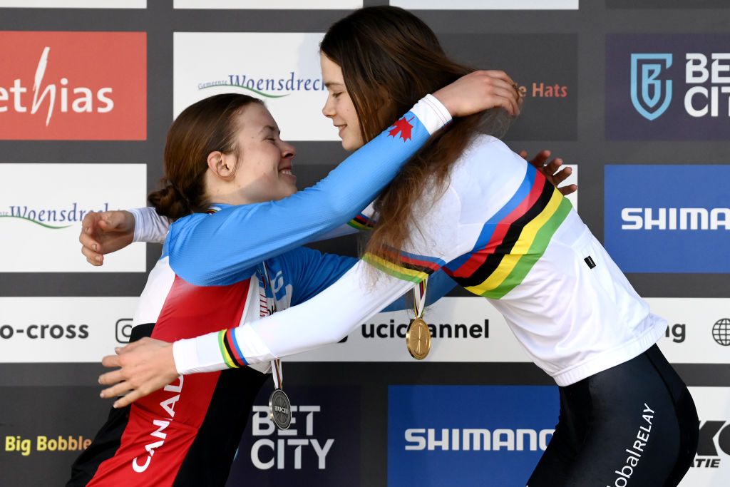 HOOGERHEIDE, NETHERLANDS - FEBRUARY 04: (L-R) Silver medalist Ava Holmgren of Canada, gold medalist Isabella Holmgren of Canada, embrace each other on the podium during the medal ceremony after during the 74th World Championships Cyclo-Cross 2023 - Women&#039;s Junior / #CXWorldCup / #Hoogerheide2023 / on February 04, 2023 in Hoogerheide, Netherlands. (Photo by David Stockman/Getty Images)