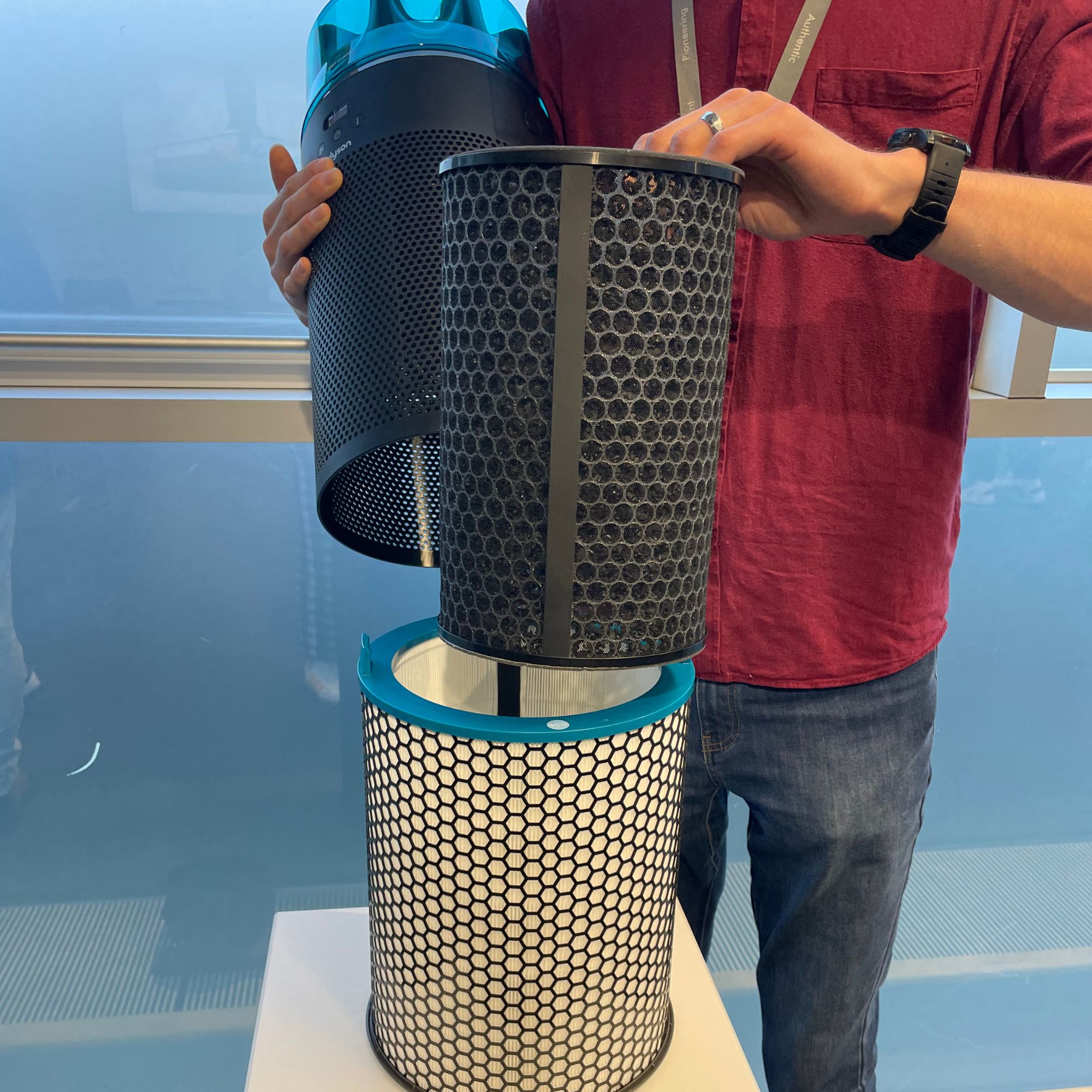 Dyson HushJet Air Purifier with a man pulling out the filters