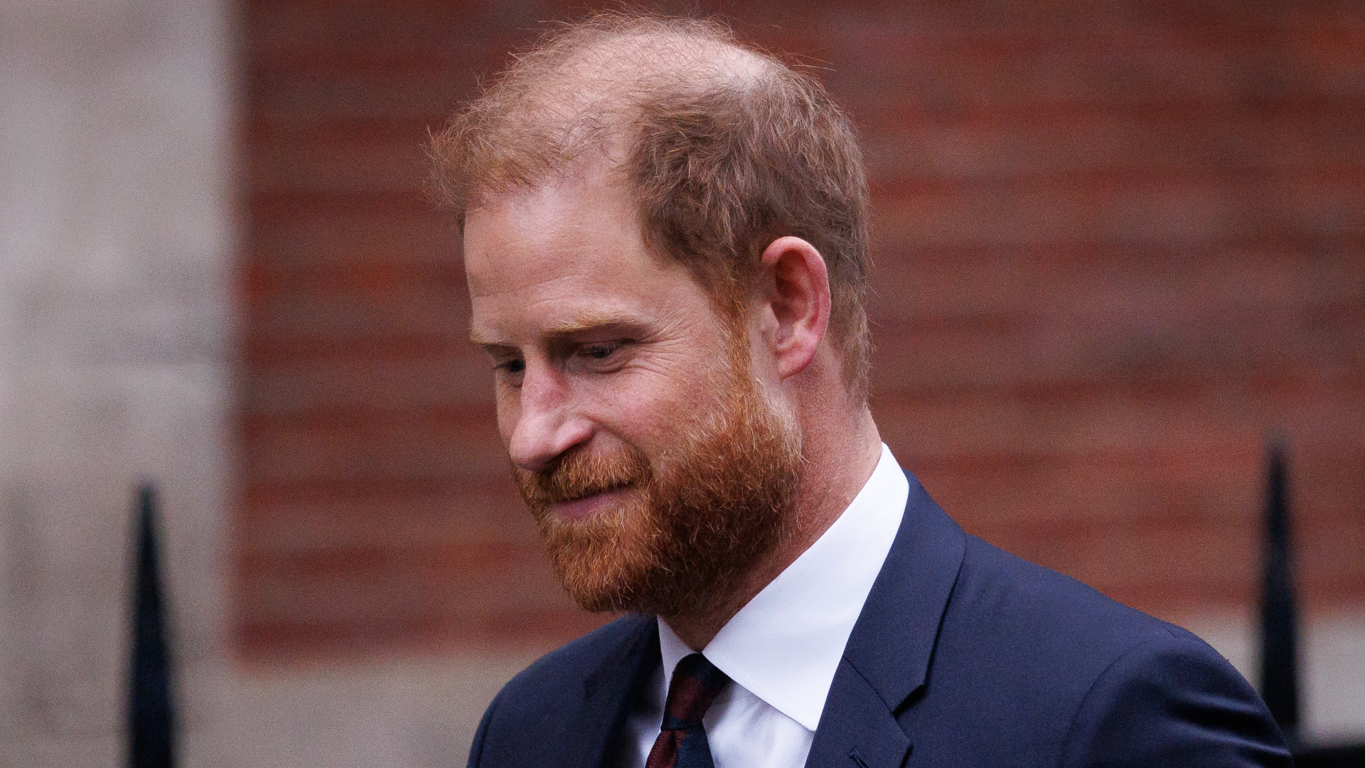 Prince Harry wearing a suit and tie 