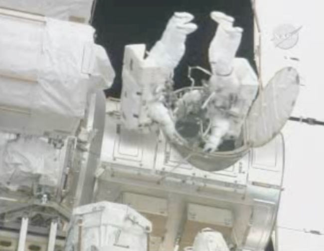 Astronauts Battle Stubborn Cable, Power Outage in Spacewalk