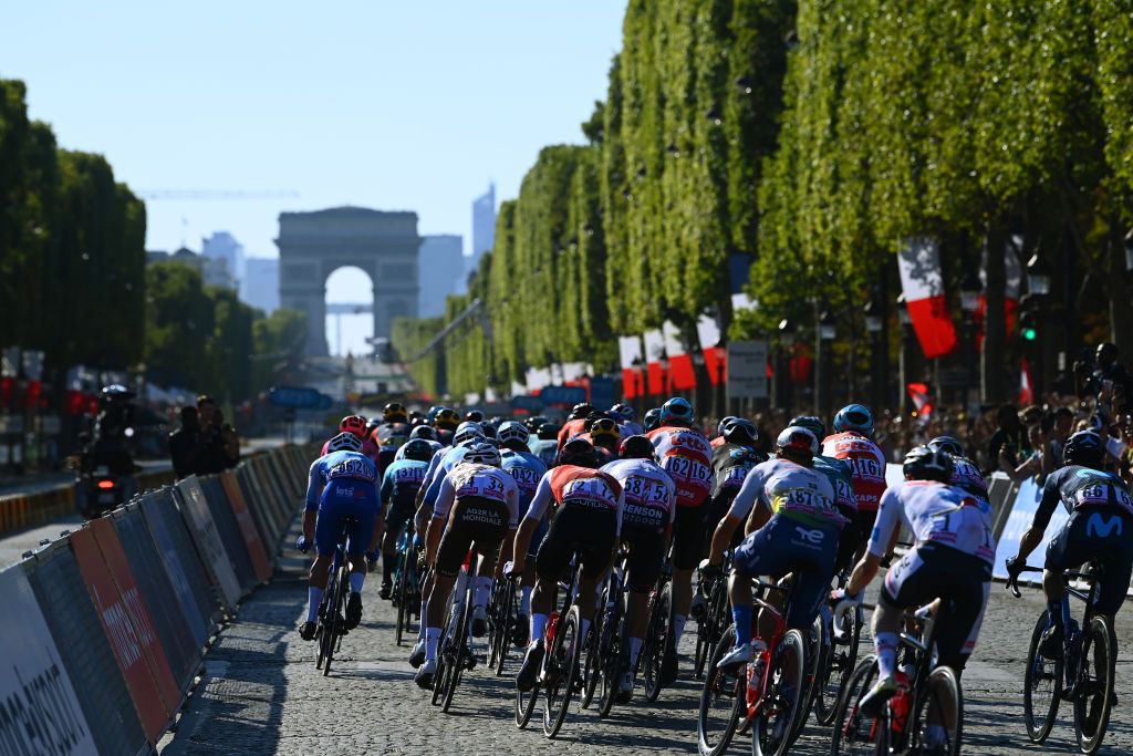 PARIS FRANCE JULY 24 A general view of Christopher Juul Jensen of Denmark and Team BikeExchange Jayco Benoit Cosnefroy of France and AG2R Citren Team PierreLuc Perichon of France and Team Cofidis Florian Senechal of France and QuickStep Alpha Vinyl Team and the peloton passing close to The Arc de Triomf during the 109th Tour de France 2022 Stage 21 a 1156km stage from Paris La Dfense to Paris Champslyses TDF2022 WorldTour on July 24 2022 in Paris France Photo by Tim de WaeleGetty Images