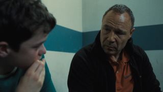 Eddie Miller (Stephen Graham) looks as his anxious son Jamie (Owen Cooper) in a prison cell.