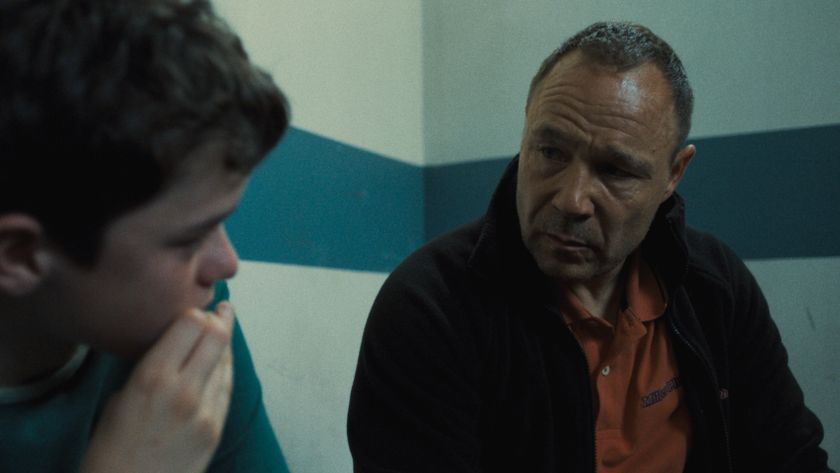 Eddie Miller (Stephen Graham) looks as his anxious son Jamie (Owen Cooper) in a prison cell.