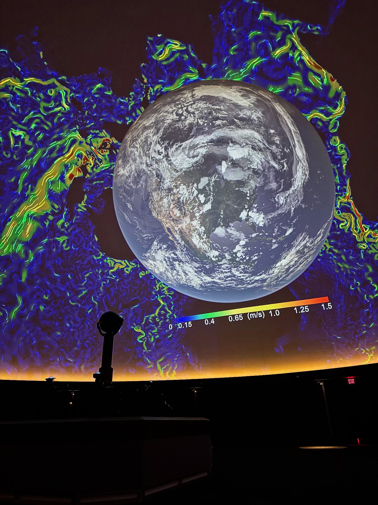 James S McDonnell Planetarium displaying the solar system and galaxy on its dome.