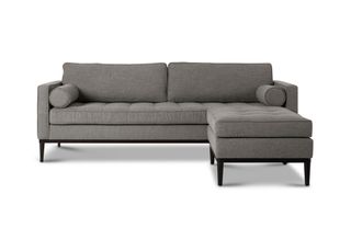 A sofa with chaise footstool in grey upholstery