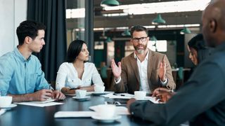 Business meeting man presents ideas to colleagues