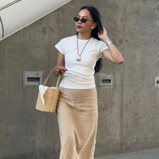 Dawn in skirt and T-shirt with basket bag