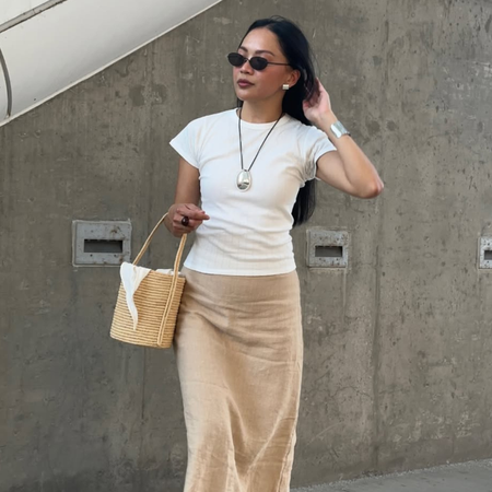 Dawn in skirt and T-shirt with basket bag