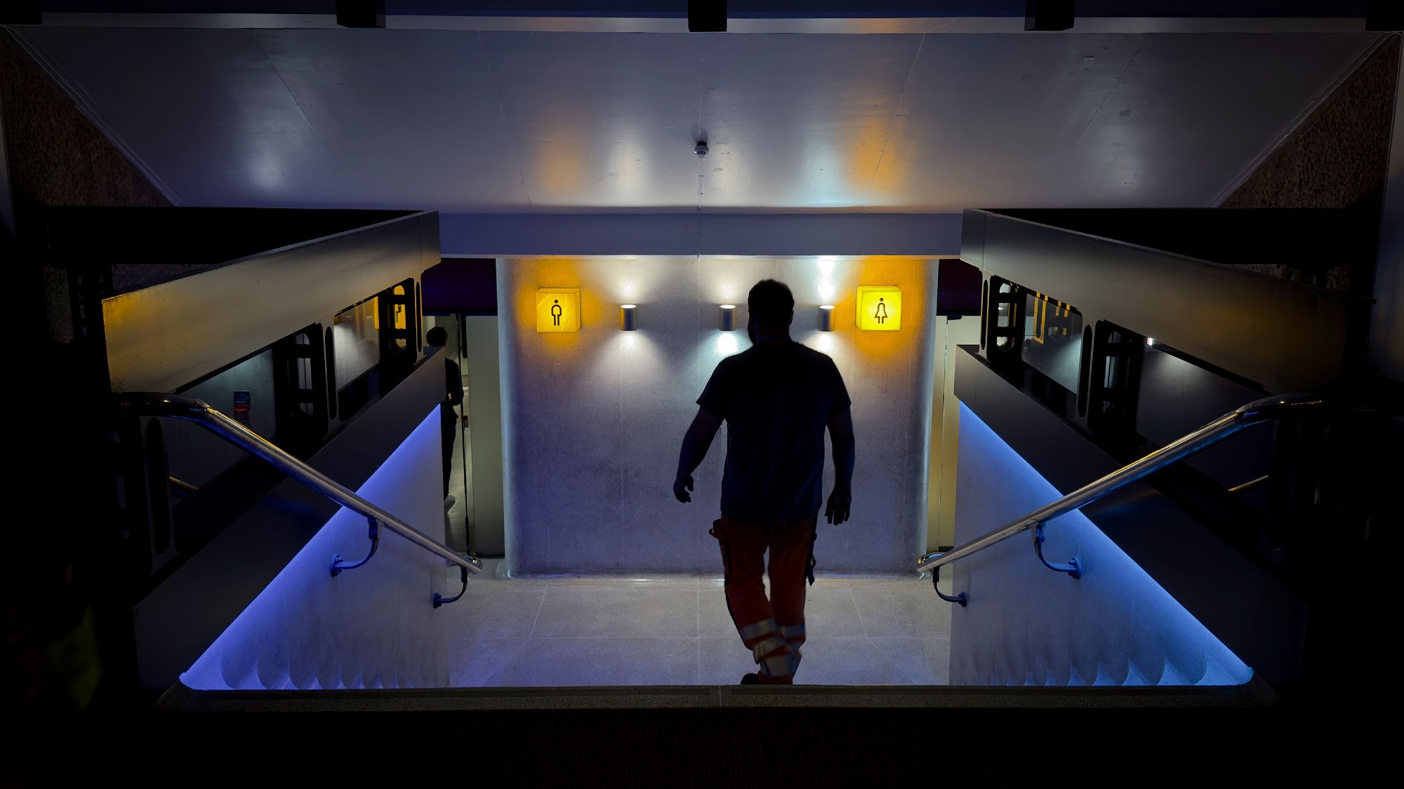 A man walks towards the toilet facilities in the Barbican Centre