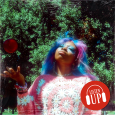 an image of singer hemlocke springs throwing a ball in the air while outside with the marie claire logo listen up over it