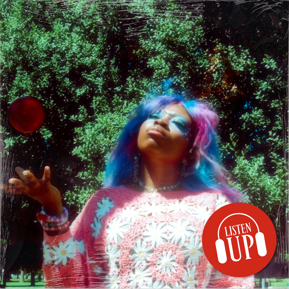 an image of singer hemlocke springs throwing a ball in the air while outside with the marie claire logo listen up over it