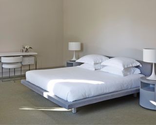 Bed in neutral bedroom on platform bed base