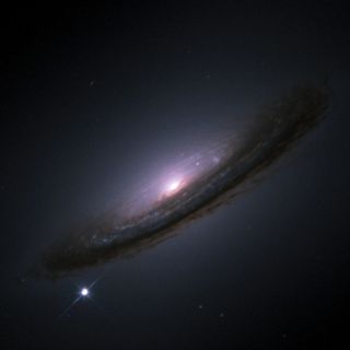 SN 1994D (bright spot on the lower left), a type Ia supernova in the NGC 4526 galaxy.
