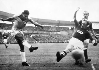 Brazil's Didi takes a shot against USSR at the 1958 World Cup.