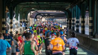 Runners cross the Queensboro Bridge as they compete during the 2019 TCS New York City Marathon