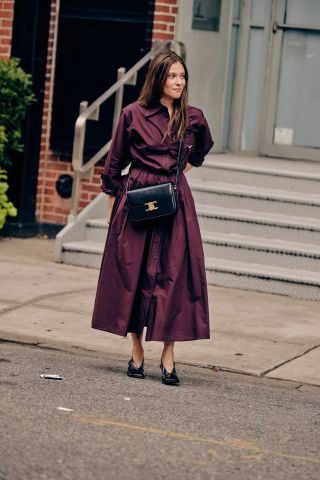 fashion director sara holzman wears a shirt dress with jil sander shoes